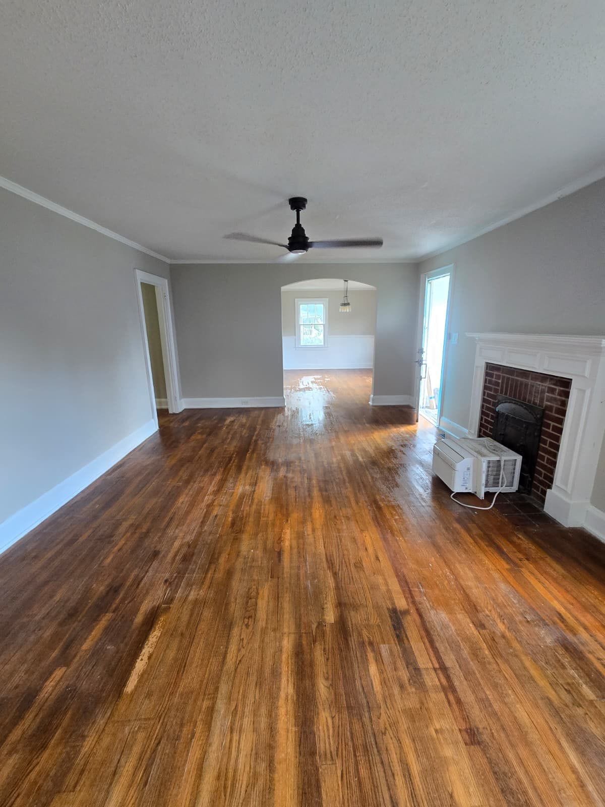Living room with fireplace, looking toward the front rooms