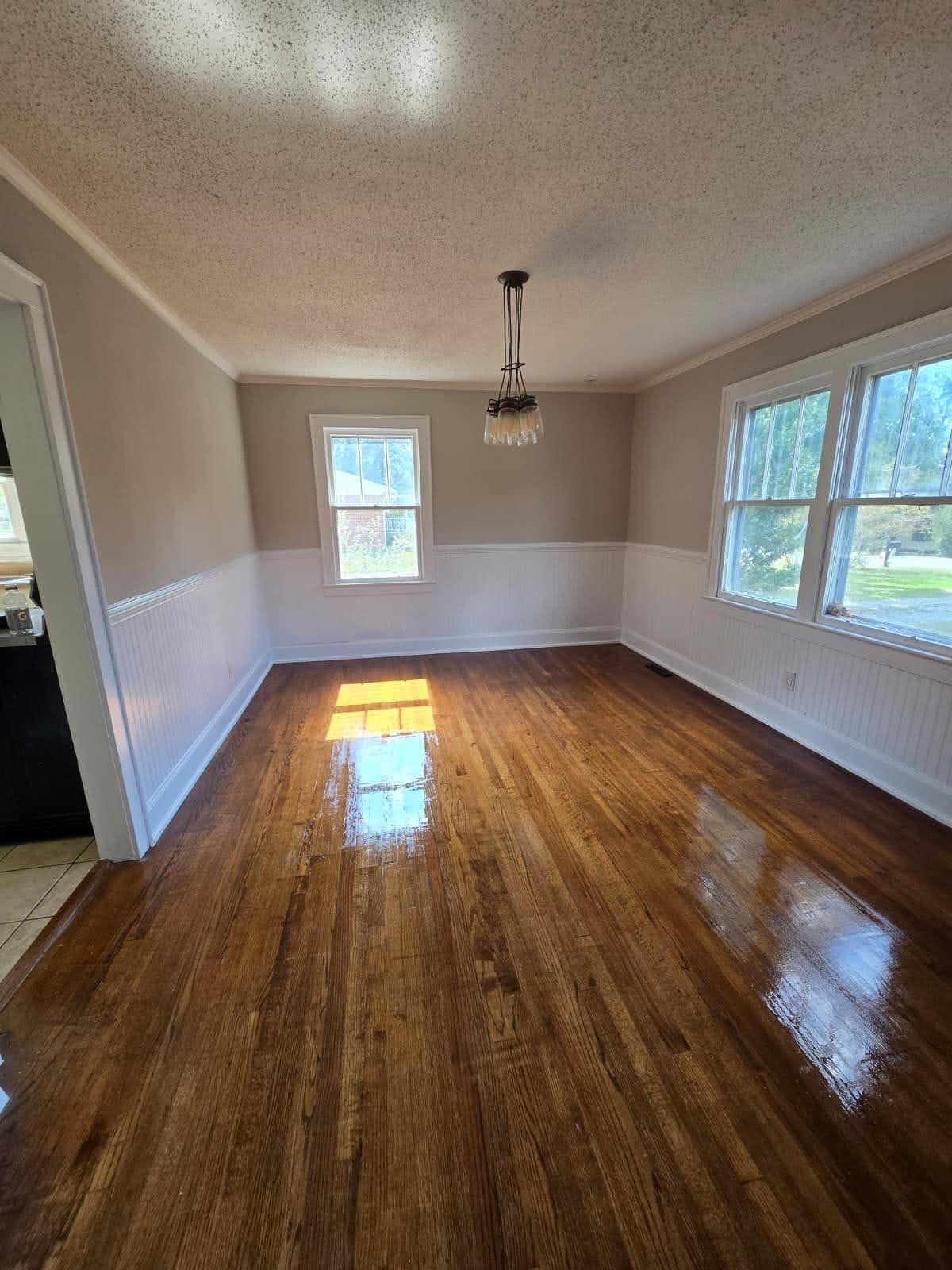 Dining room with wainscoting and hardwood floors