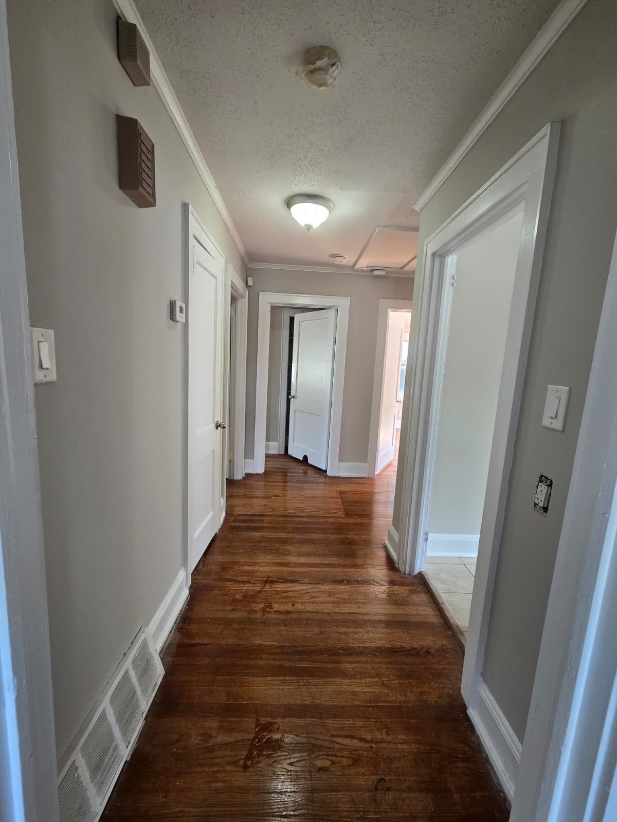 Hallway with hardwood floors