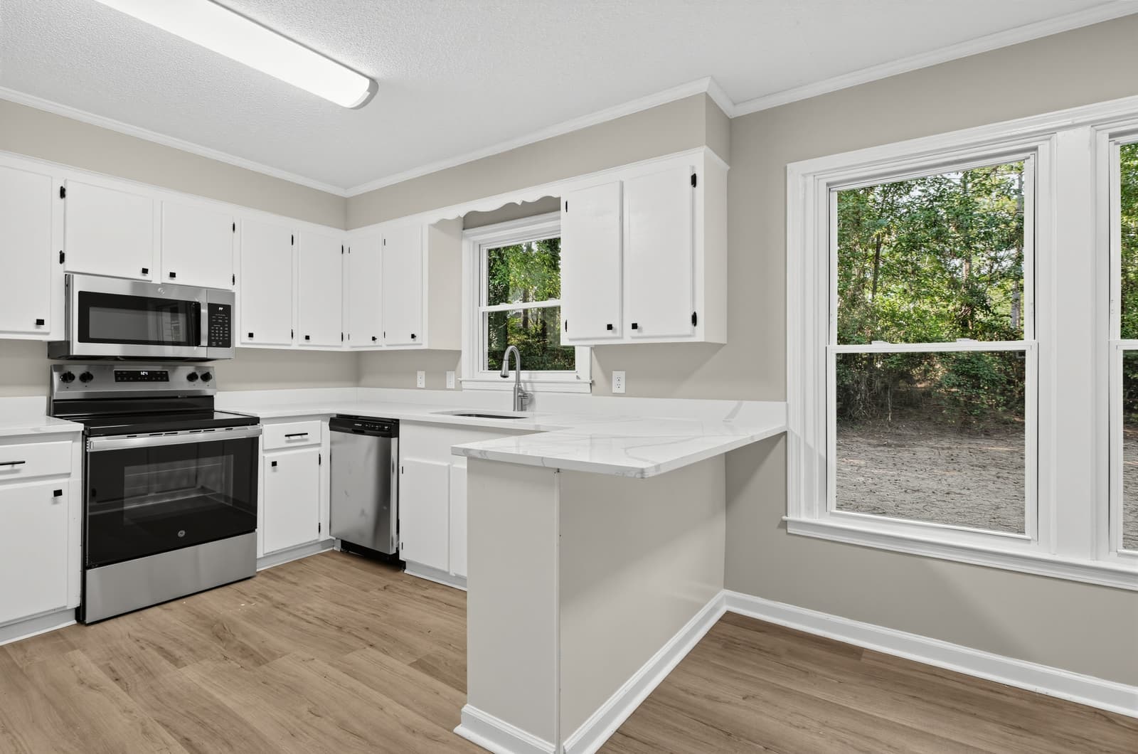 Kitchen with white cabinets and stainless-steel appliances